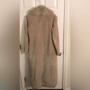 100% Leather Faux Fur lined full length coat.